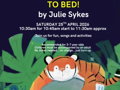 April 2026 Story Time Poster featuring a reclining tiger